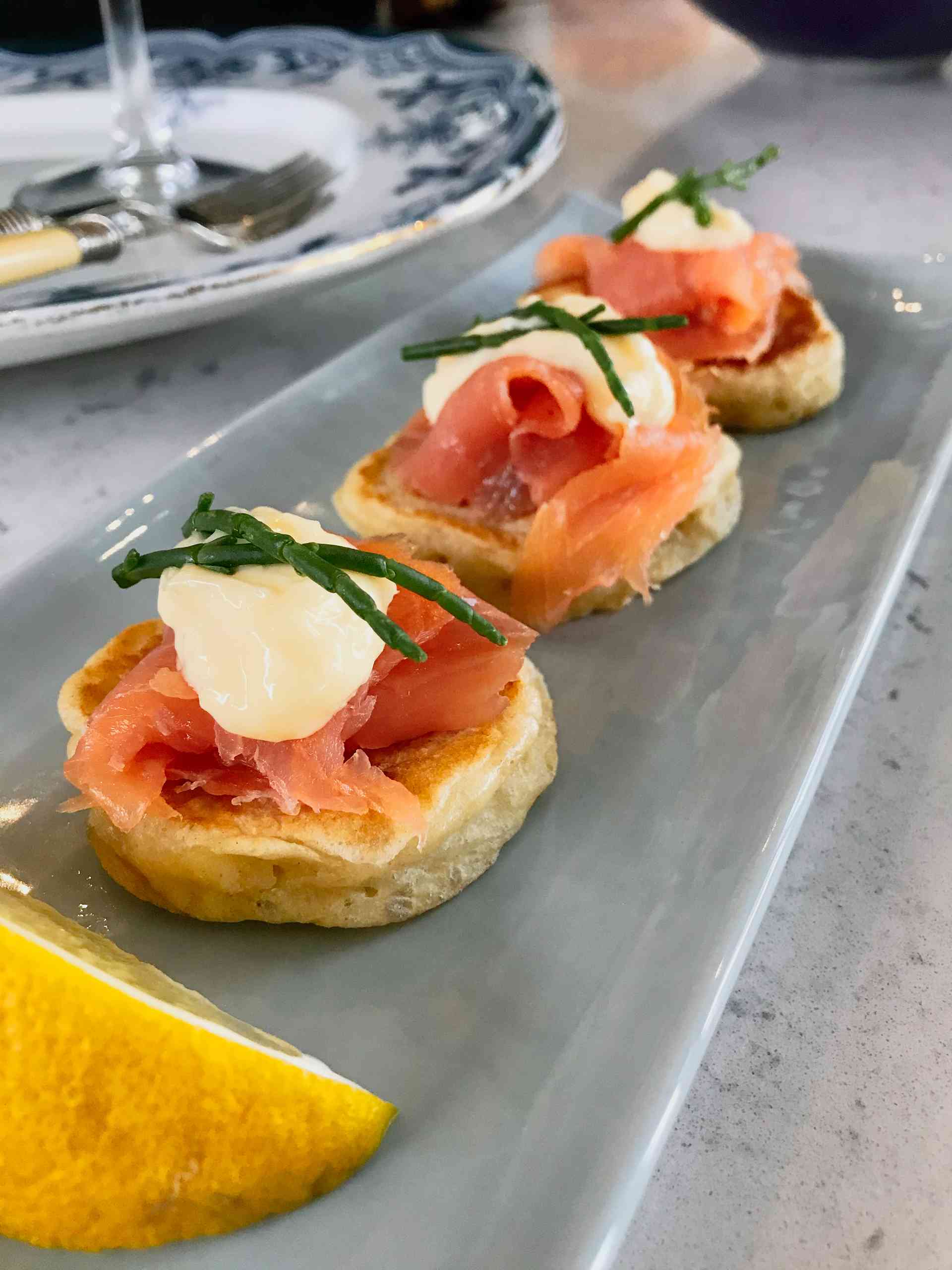 Salmon Blinis on a plate.
