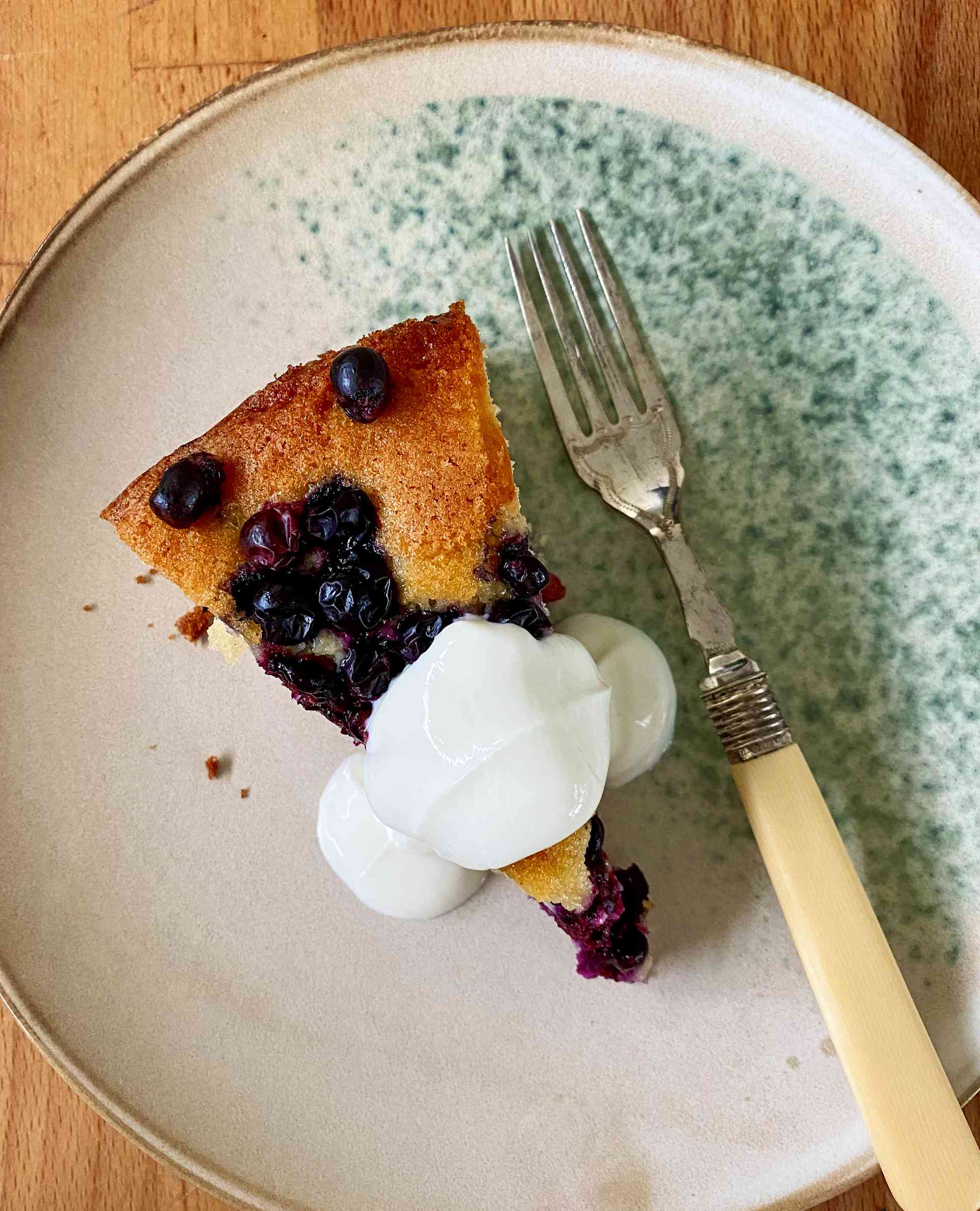 Top view of Grape and Olive Oil Cake slice on a sideplate.