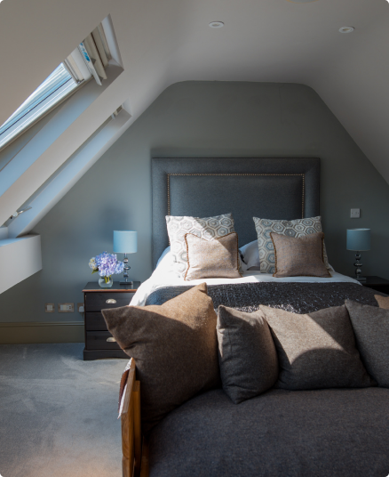 Bed view light shining inside through window.