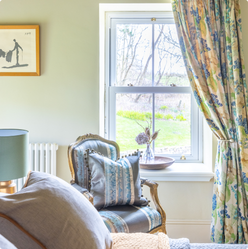 Cozy room with floral curtains.