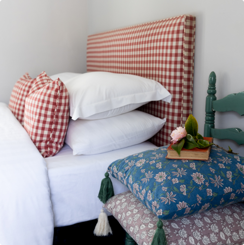Cozy bed with decorative pillows.