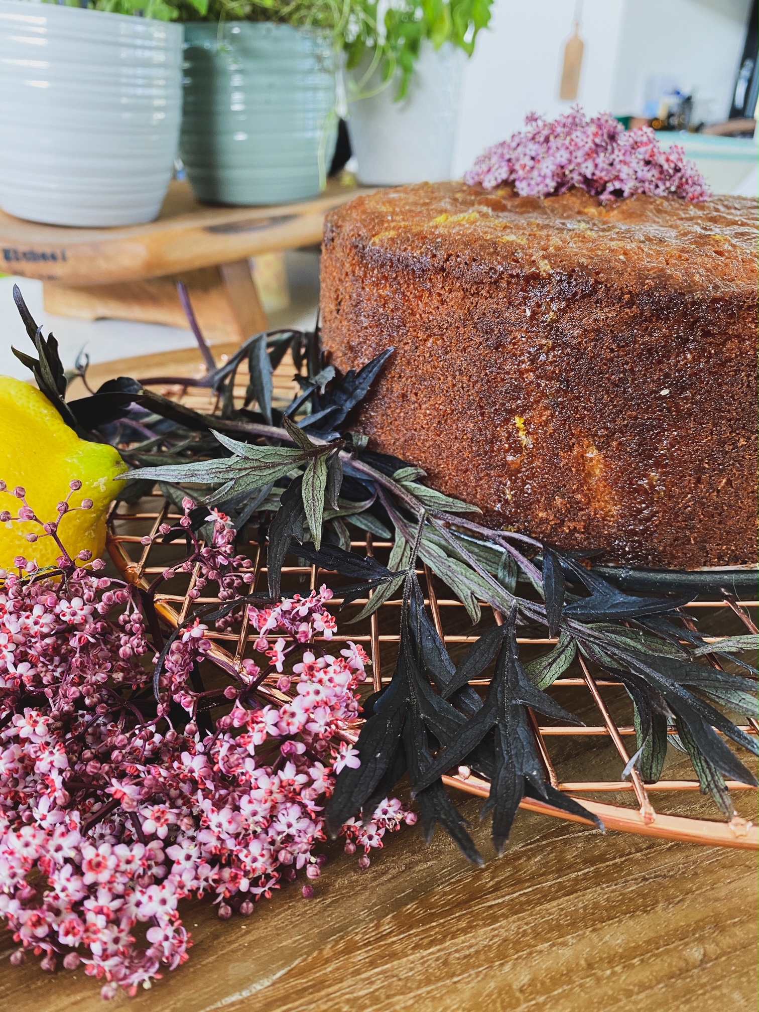 Elderflower, Lemon and Courgette Cake on a rack.