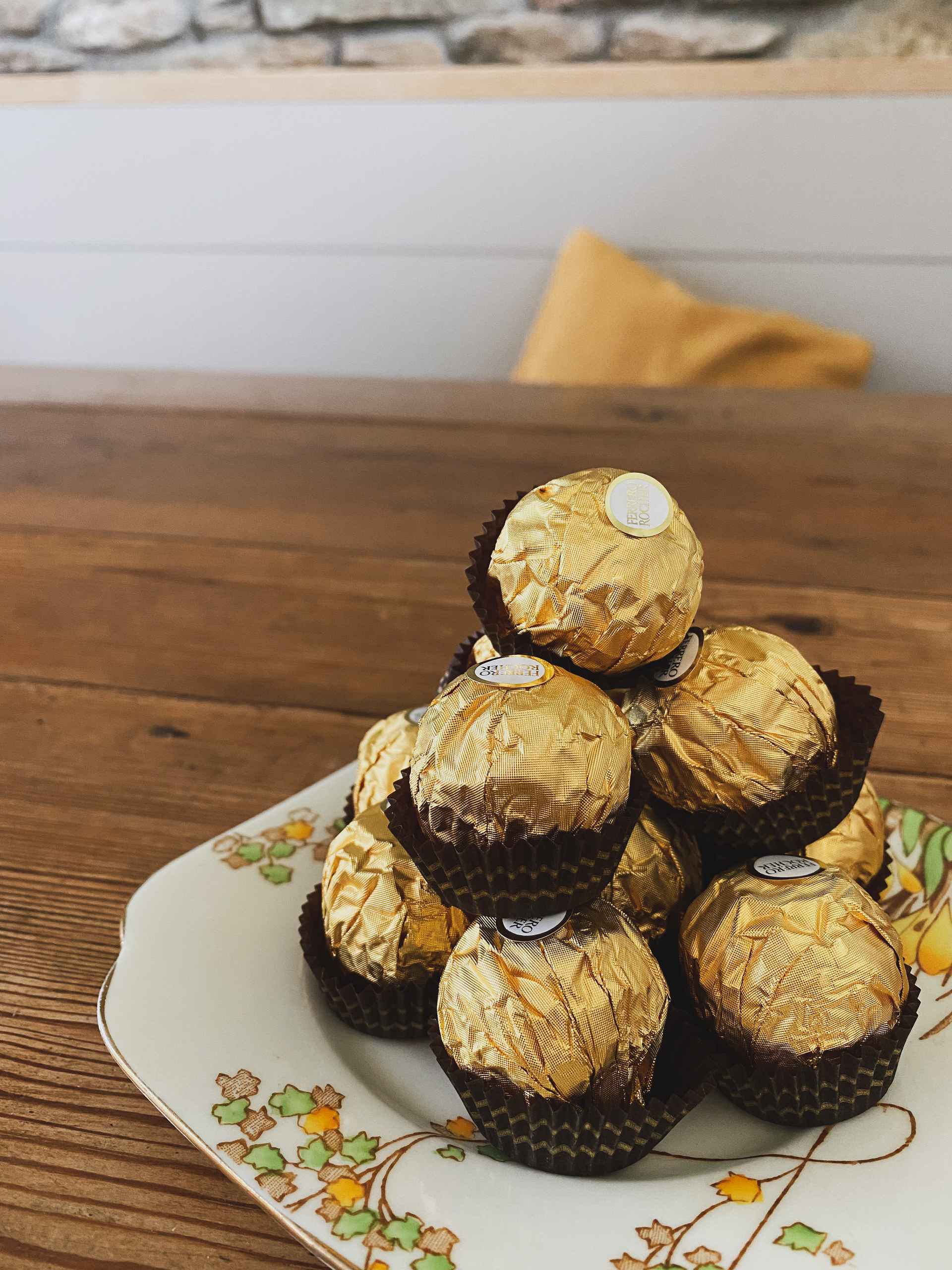 Ferrero Rocher Chocolate on a sideplate.