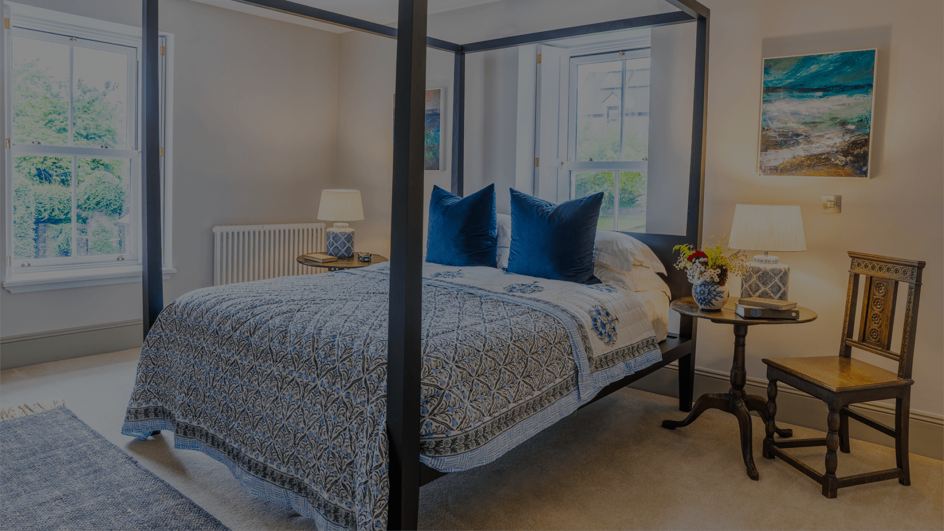 Dunowen bedroom suite, blue pillows and an white blue and black duvet.