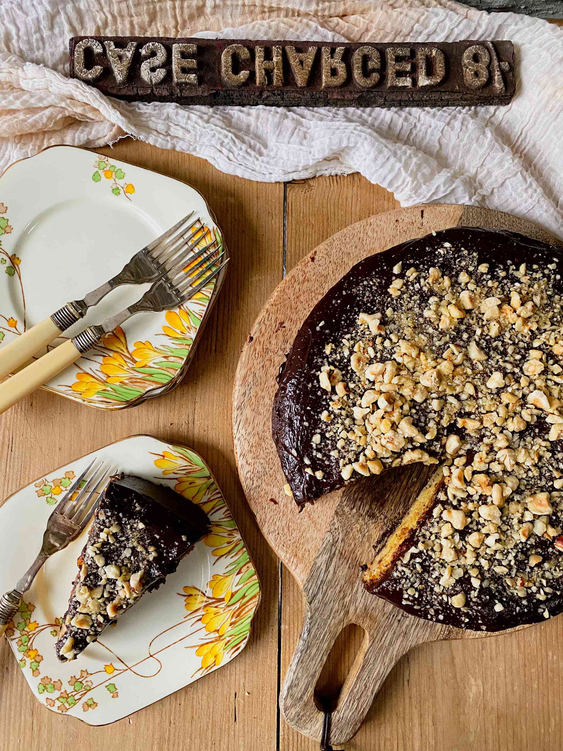 Ferrero Rocher Chocolate Cake on a wooden plate.