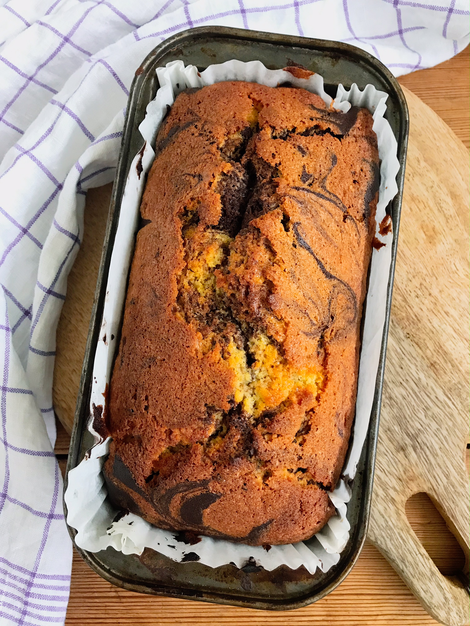 Finished Chocolate marble pound cake in a cake tin.