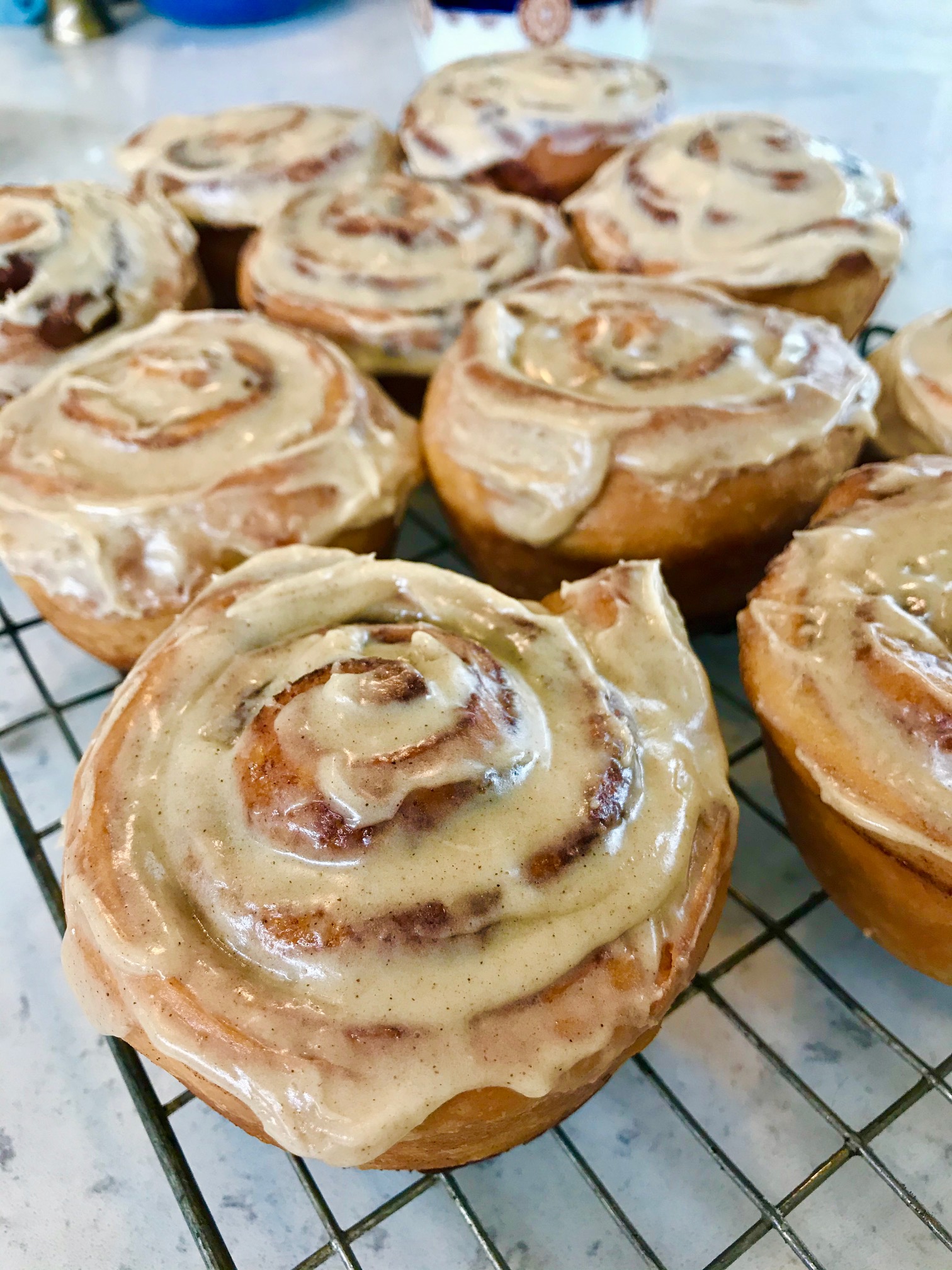 Cinnamon Rolls on a rack.