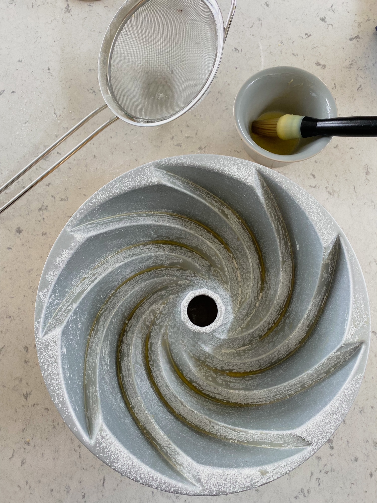 Empty cake tin on a kitchen countertop.
