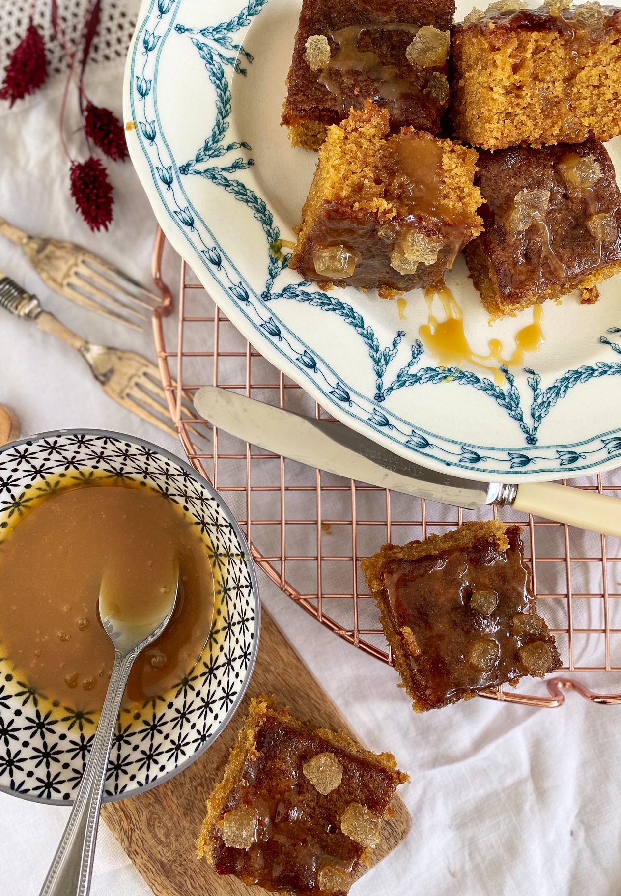 Salted Caramel and Stem Ginger Cake on a plate on a rack.
