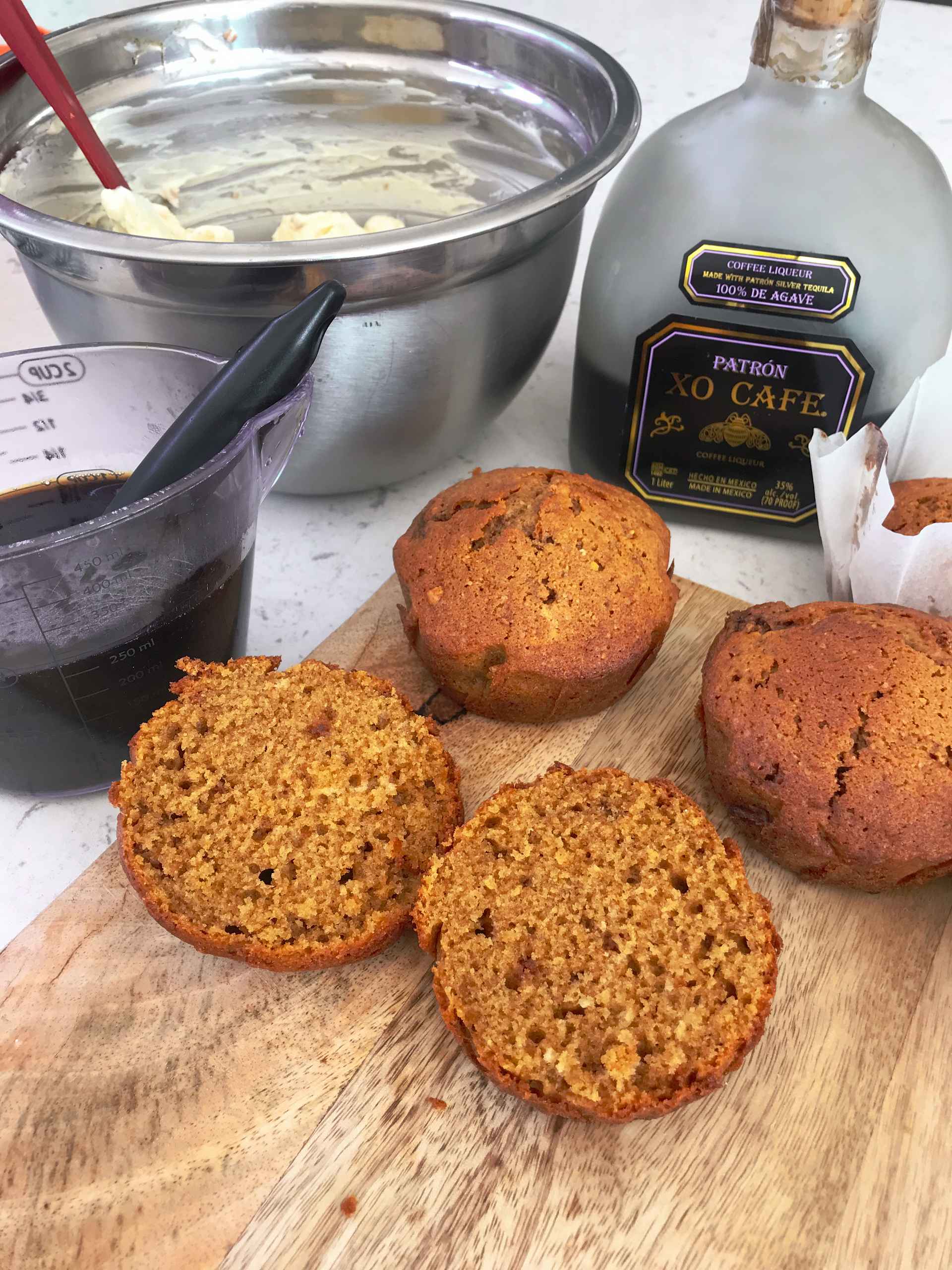 Mini tiramisu cakes on a wooden plate.