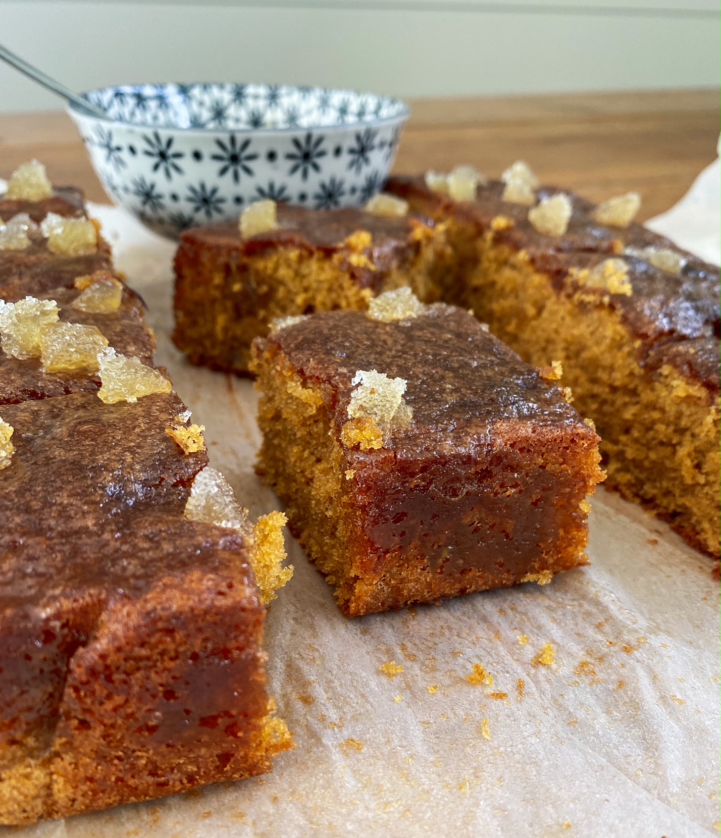 Salted Caramel and Stem Ginger Cake pieces on a wooden plank.