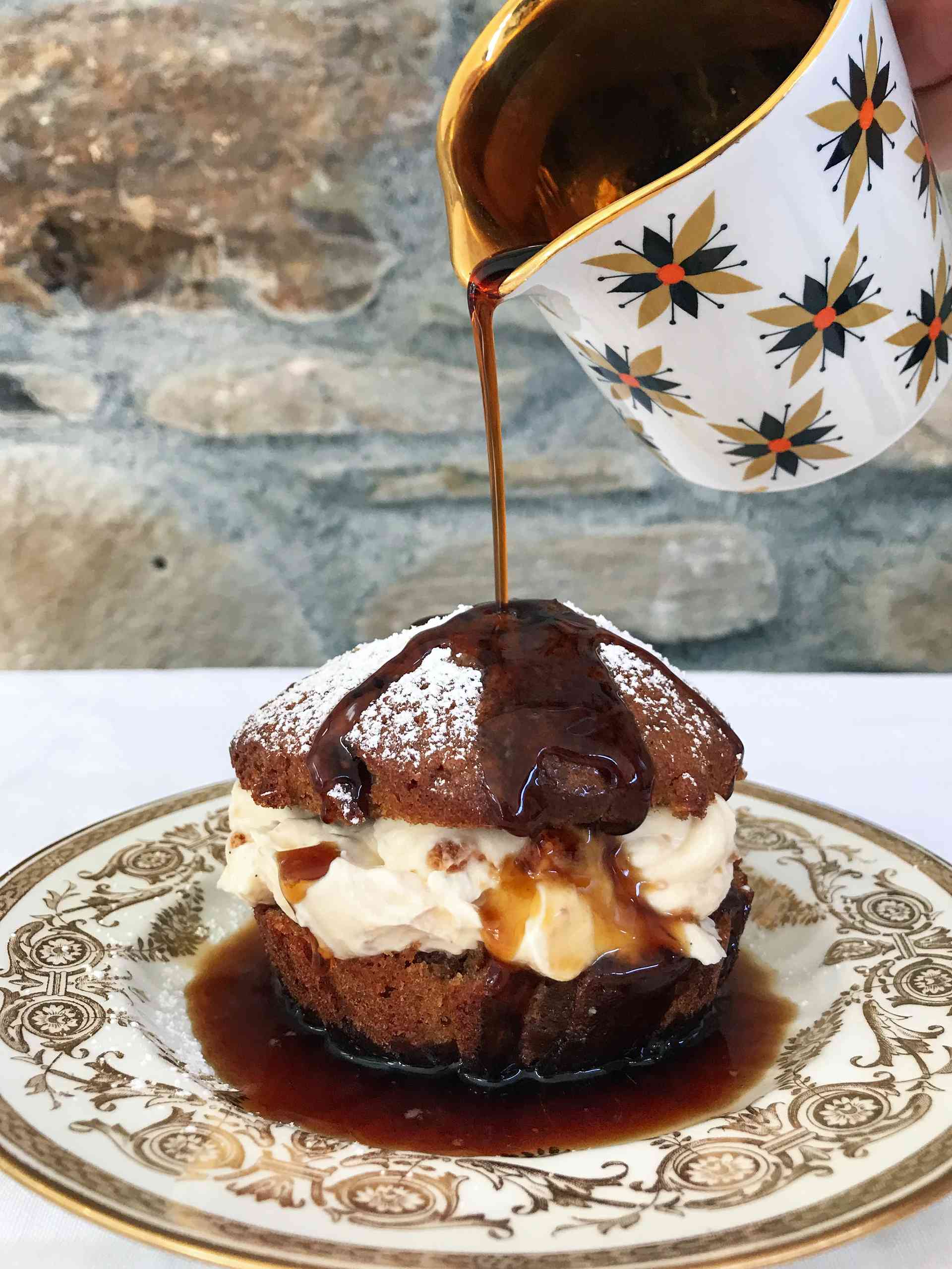 Mini tiramisu cakes getting poured.