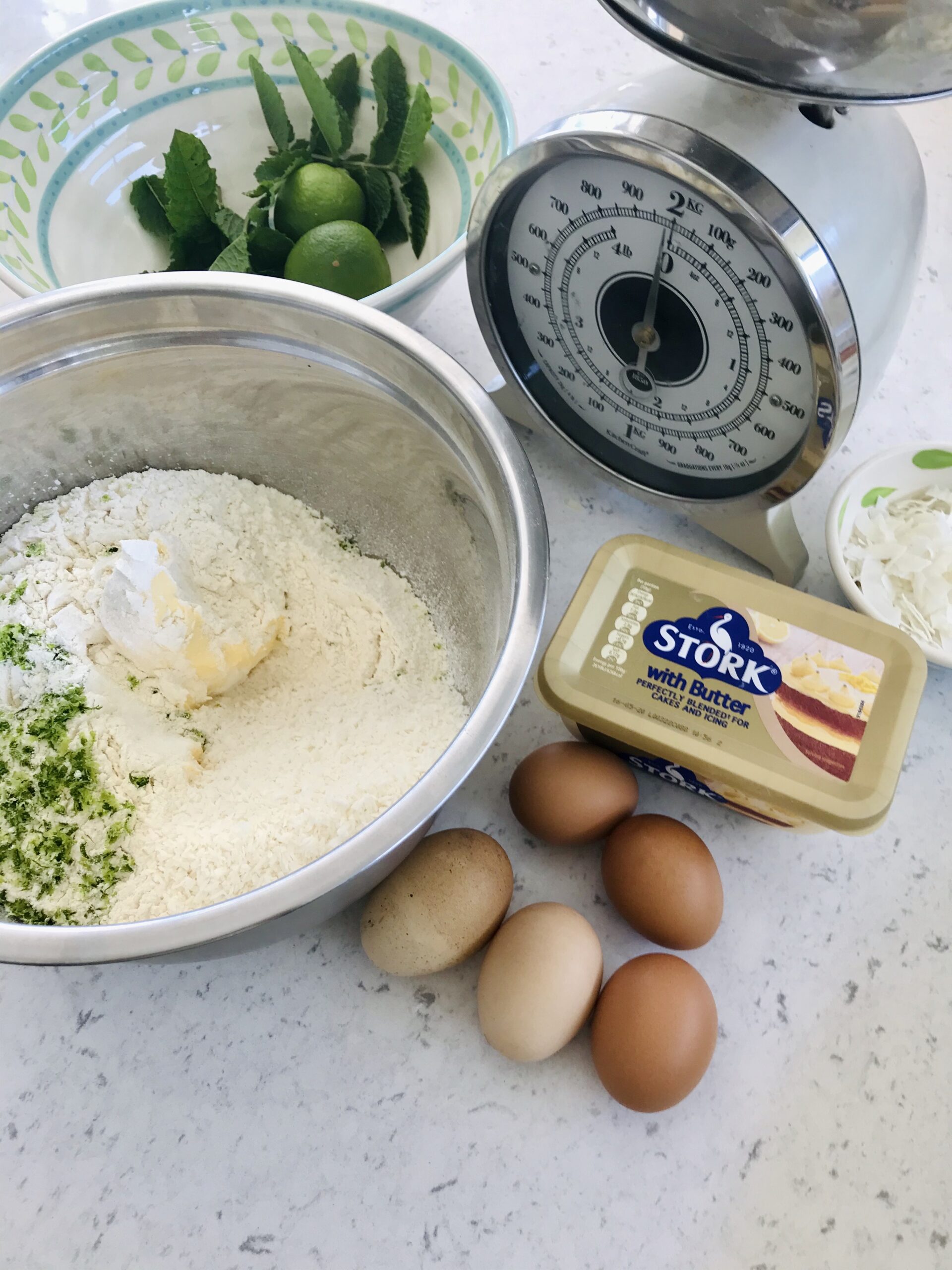 Mojito cake ingredients on a kitchen countertop.