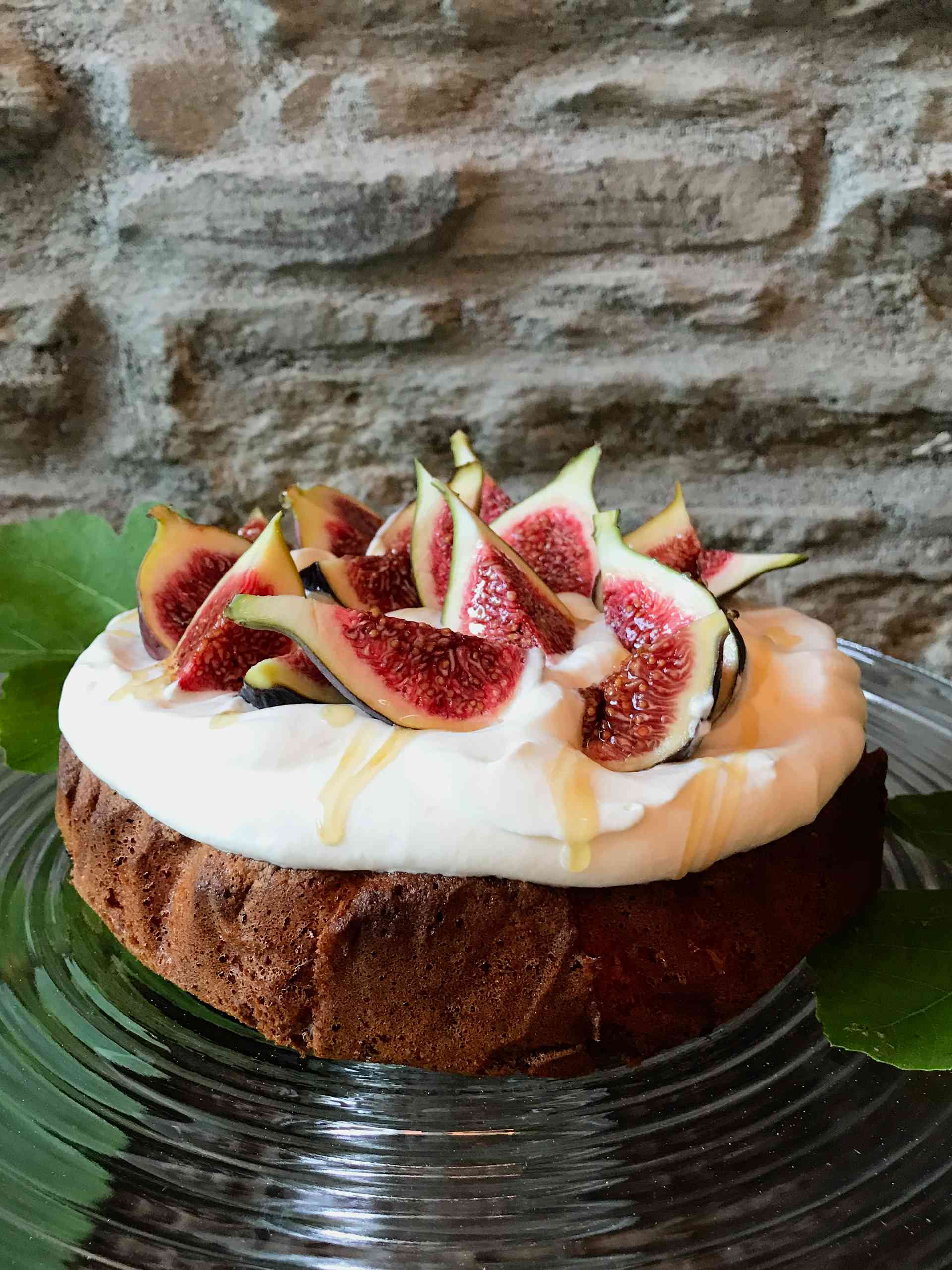 Fig topped Hazelnut brown butter cake on a plate.