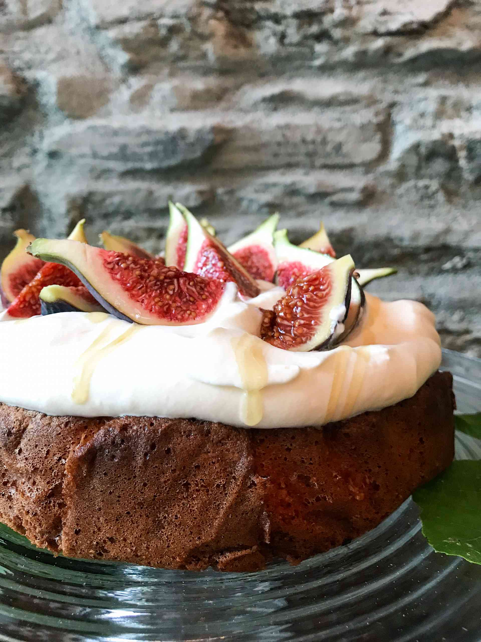 Fig topped Hazelnut brown butter cake on a plate.