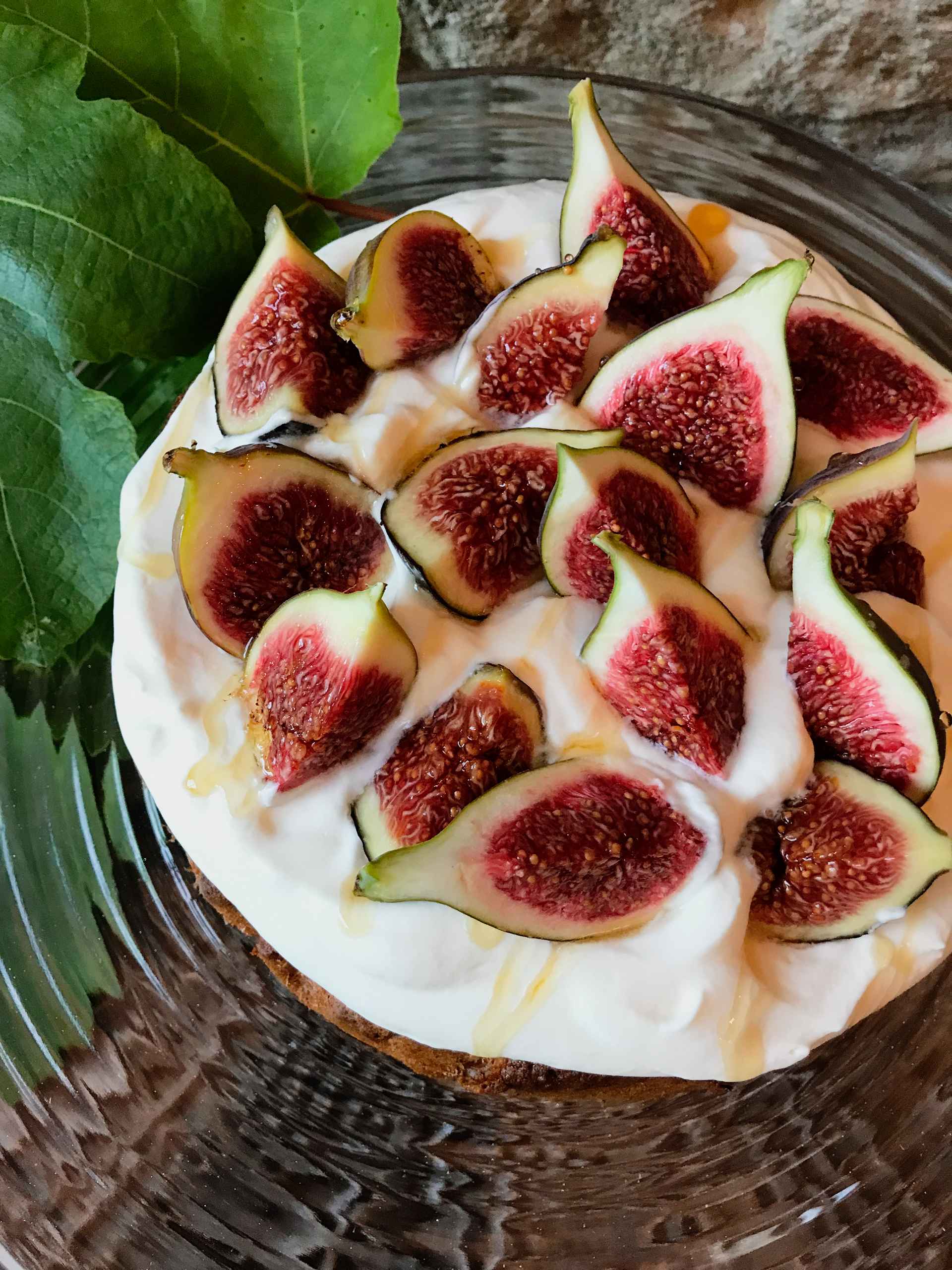 Fig topped Hazelnut brown butter cake on a plate.