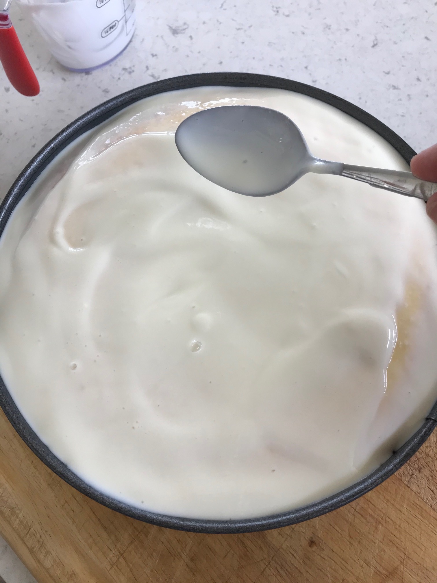 New York cheesecake mixture on a kitchen countertop.