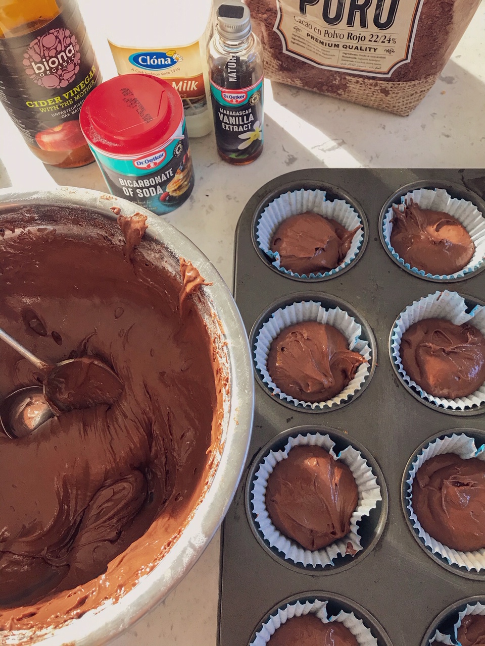 Red velvet cupcakes being made.