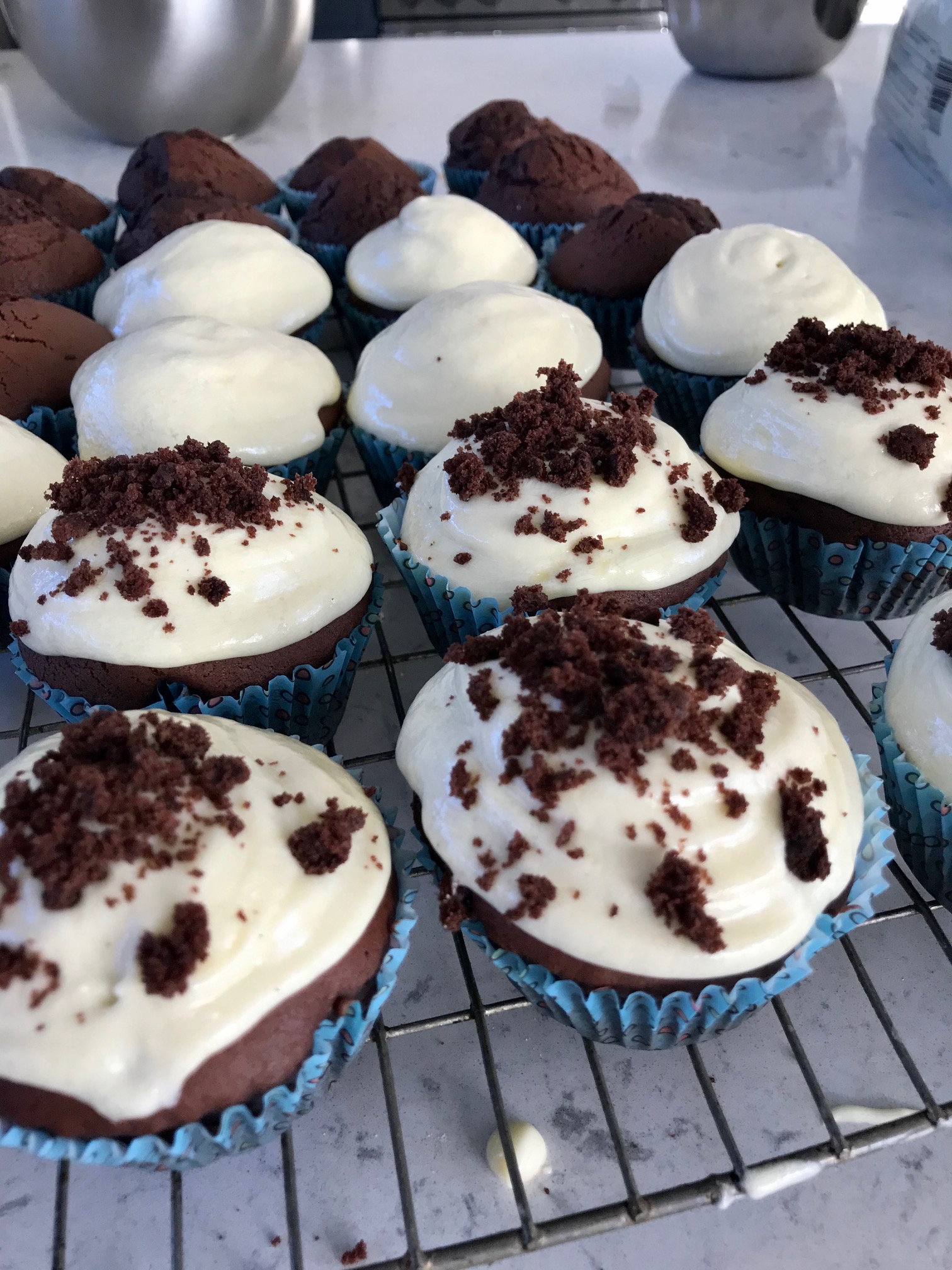 Red velvet cupcakes on a rack.