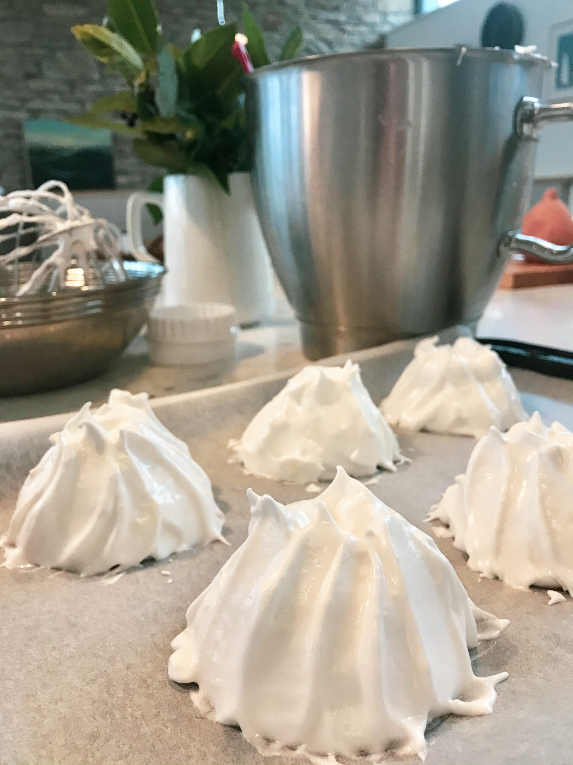 Mulled Fruit Pavlova whipped cream on a plate.