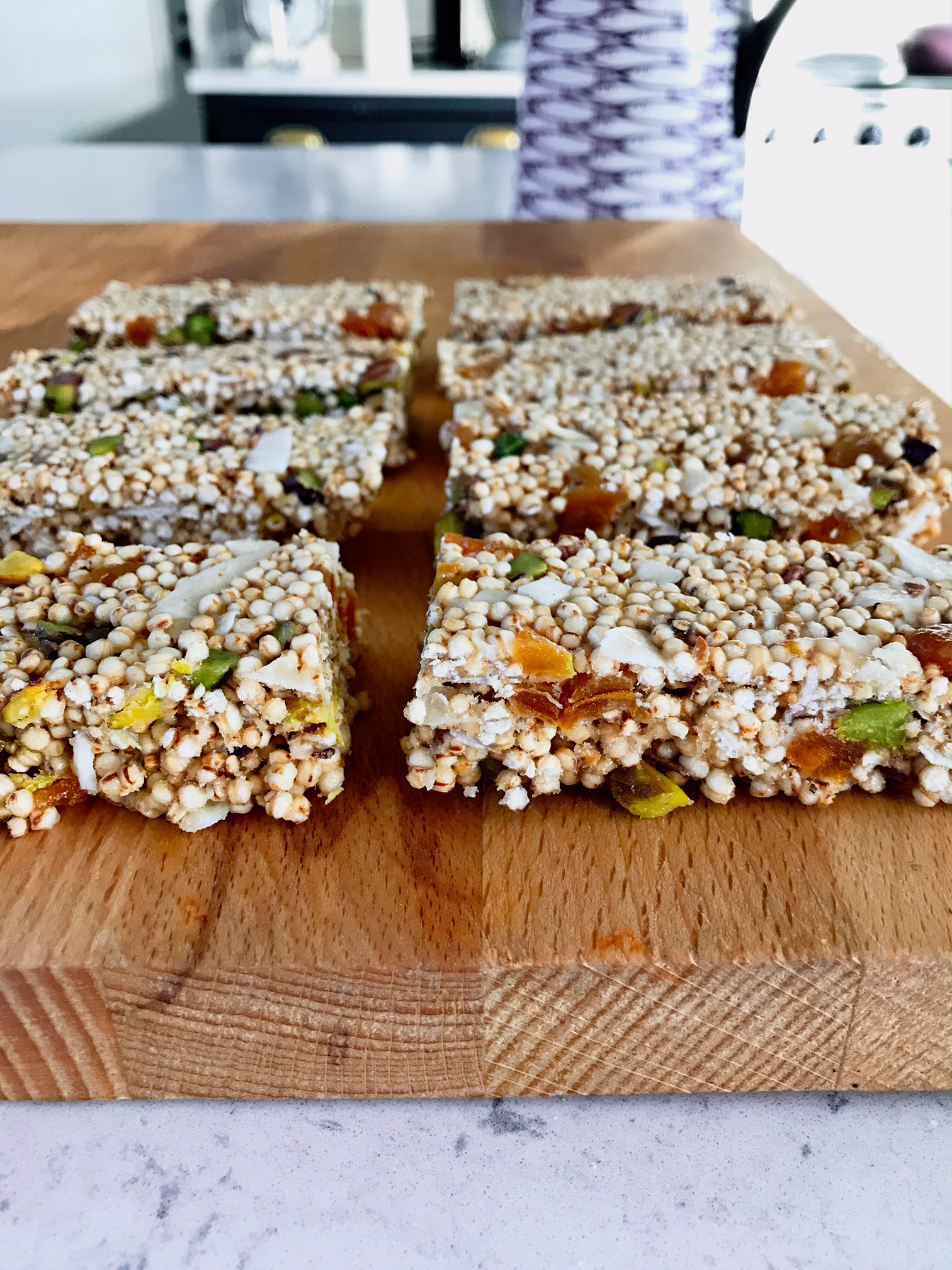 Puffed protein energy bars on a wooden plate.