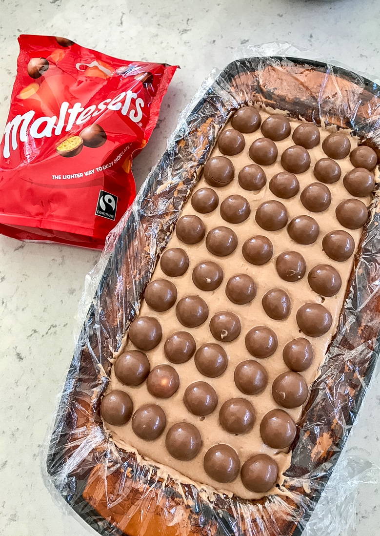 Malteser Hazelnut Frozen Parfait cake in a oven tin.