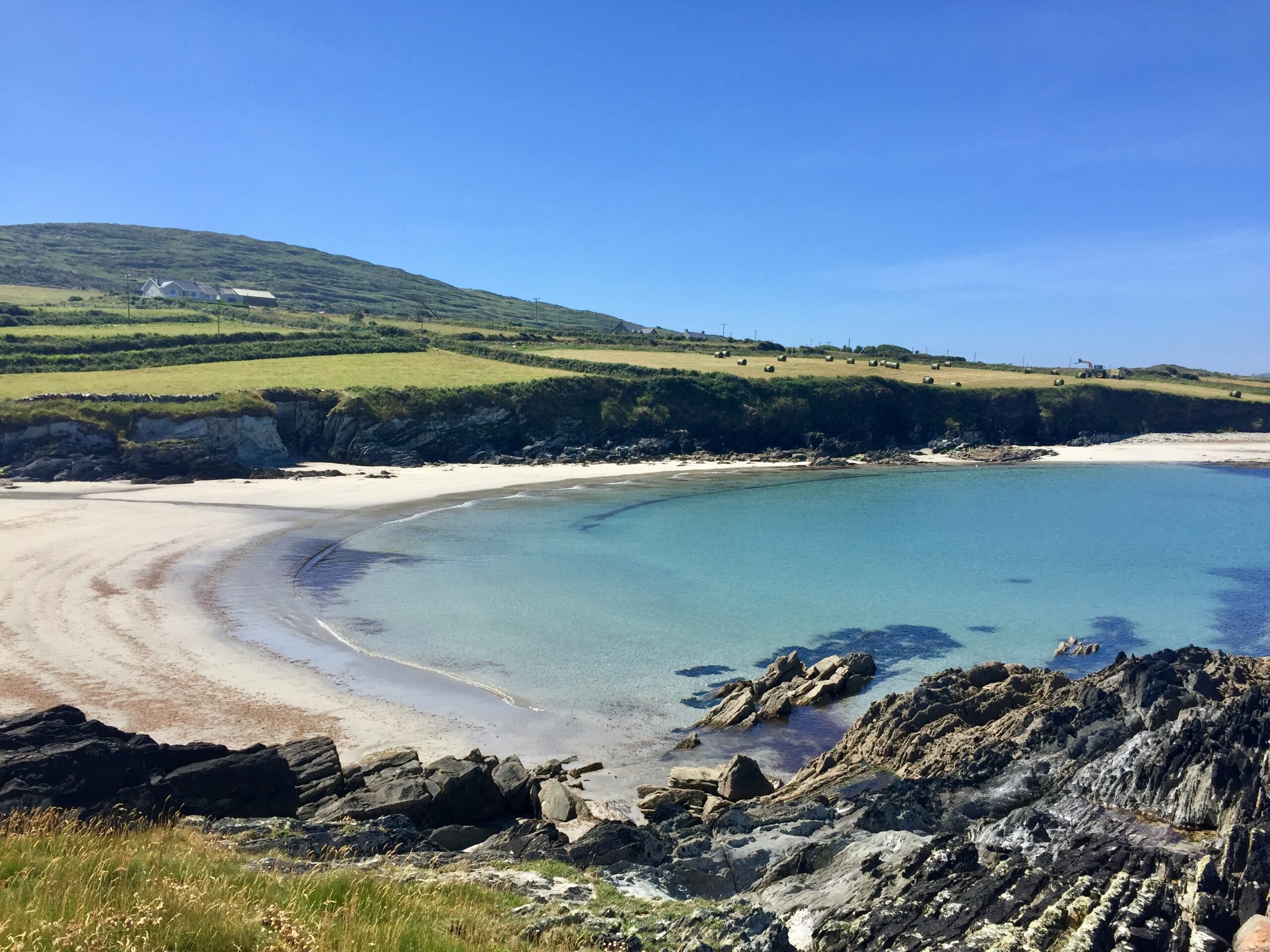Irish beach with bright blue water.