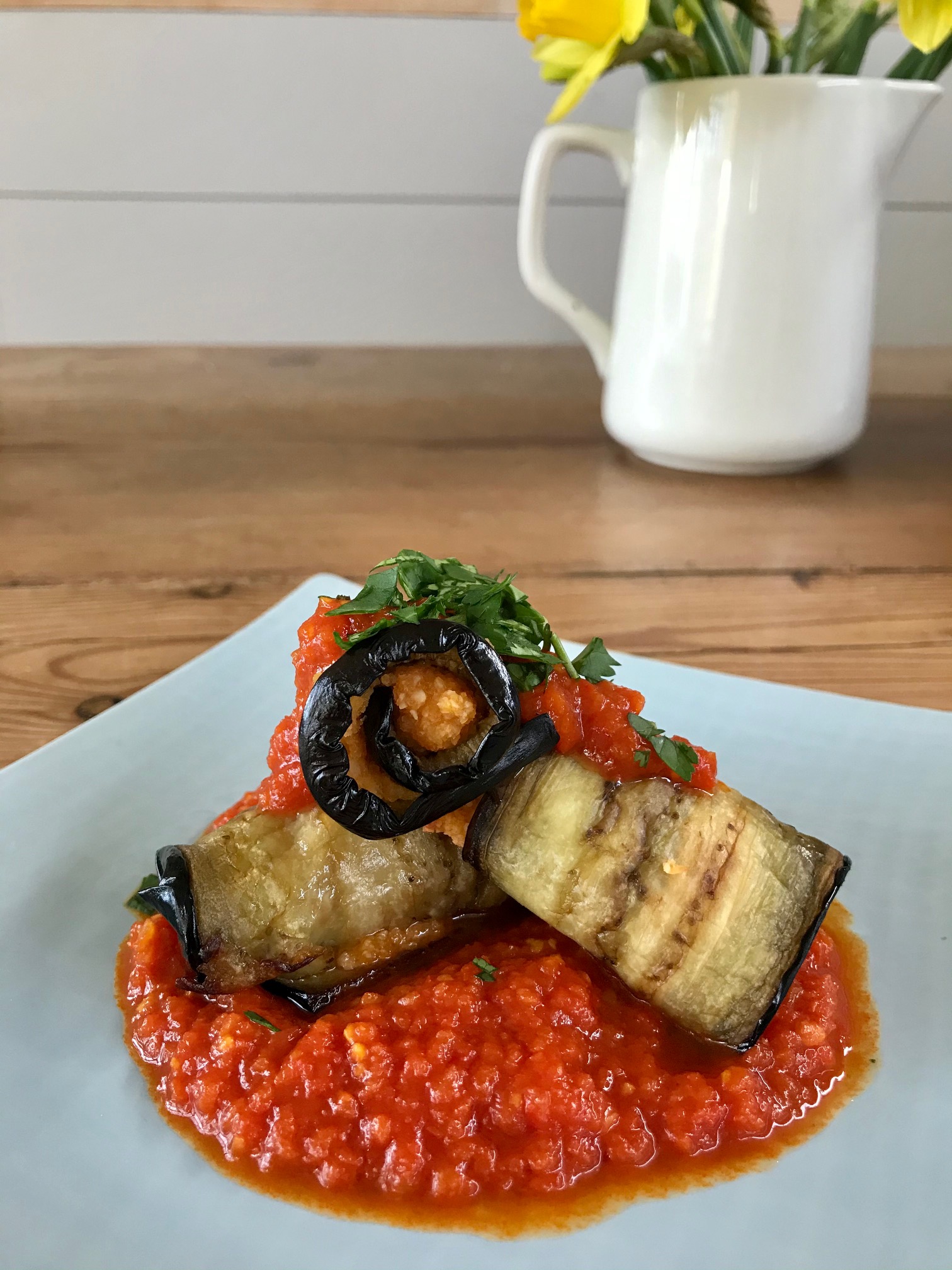 Mince Aubergine Rolls presented on a plate.