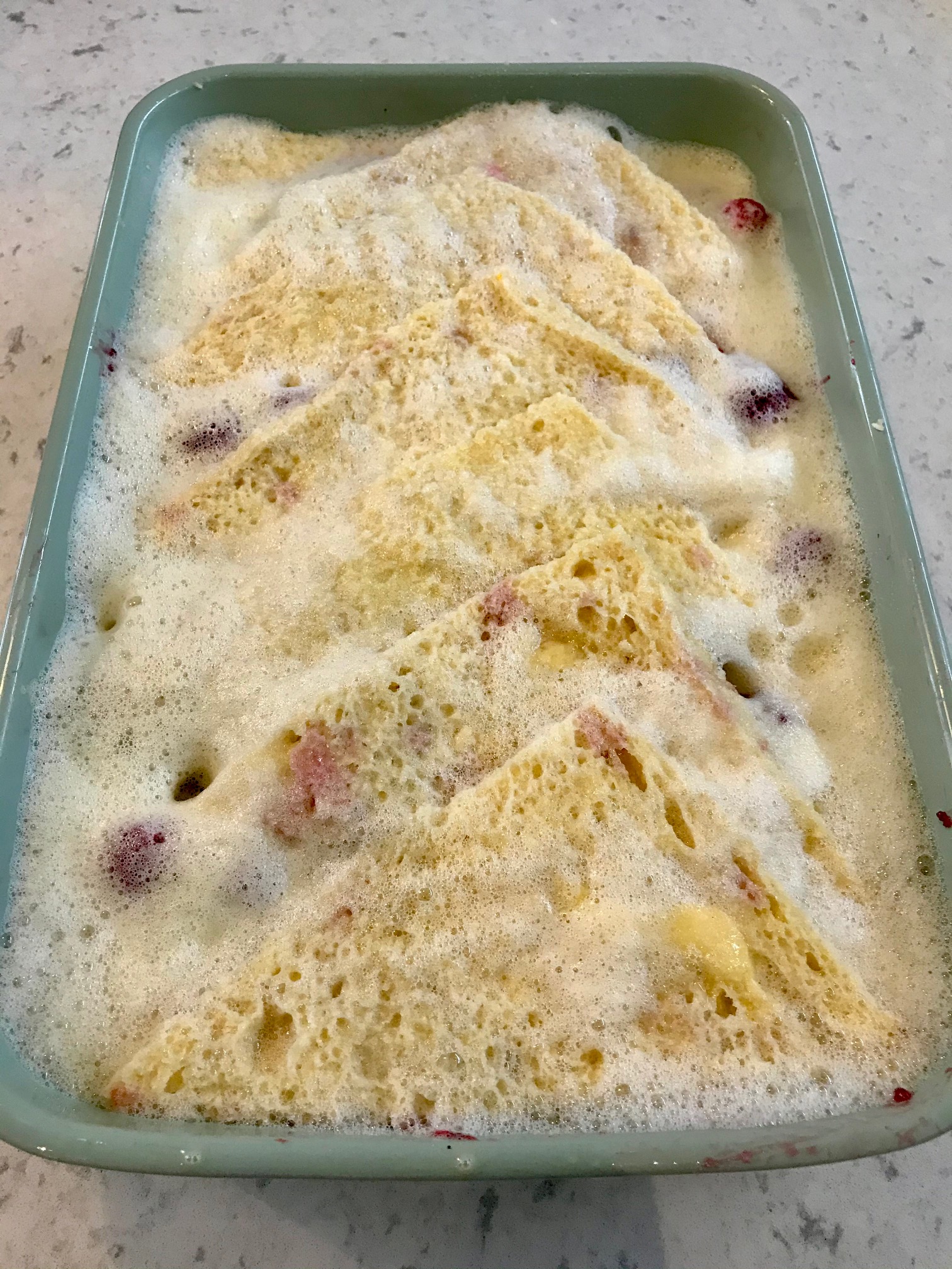 Raspberry Bread in a baking dash on a kitchen countertop.