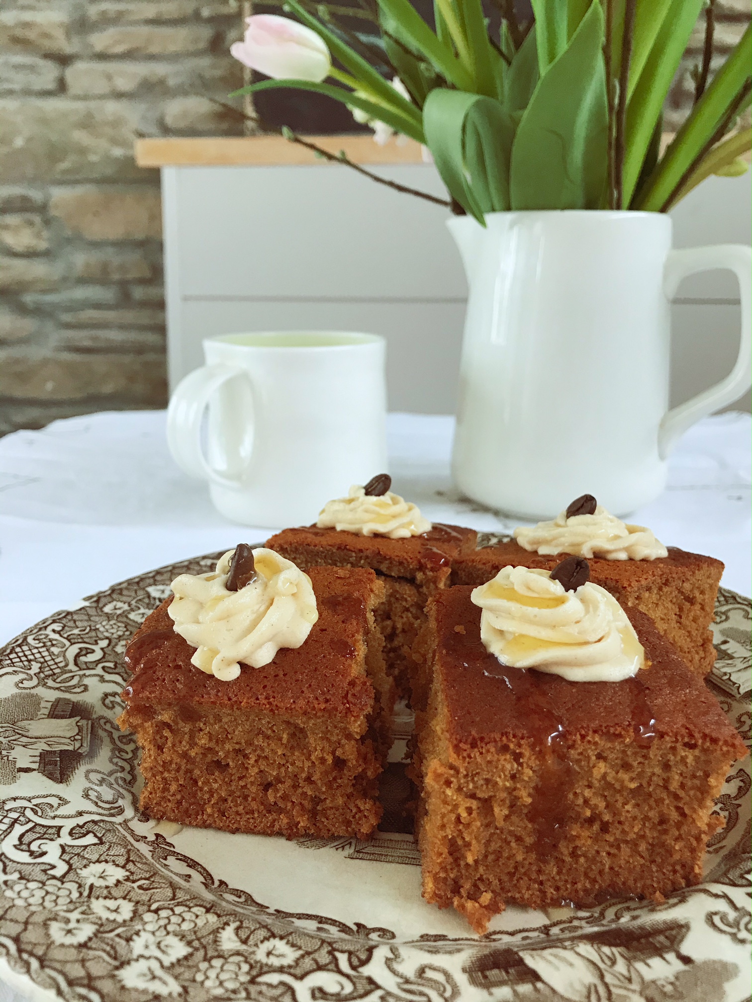 Honey and spice cakes on a plate on a table.