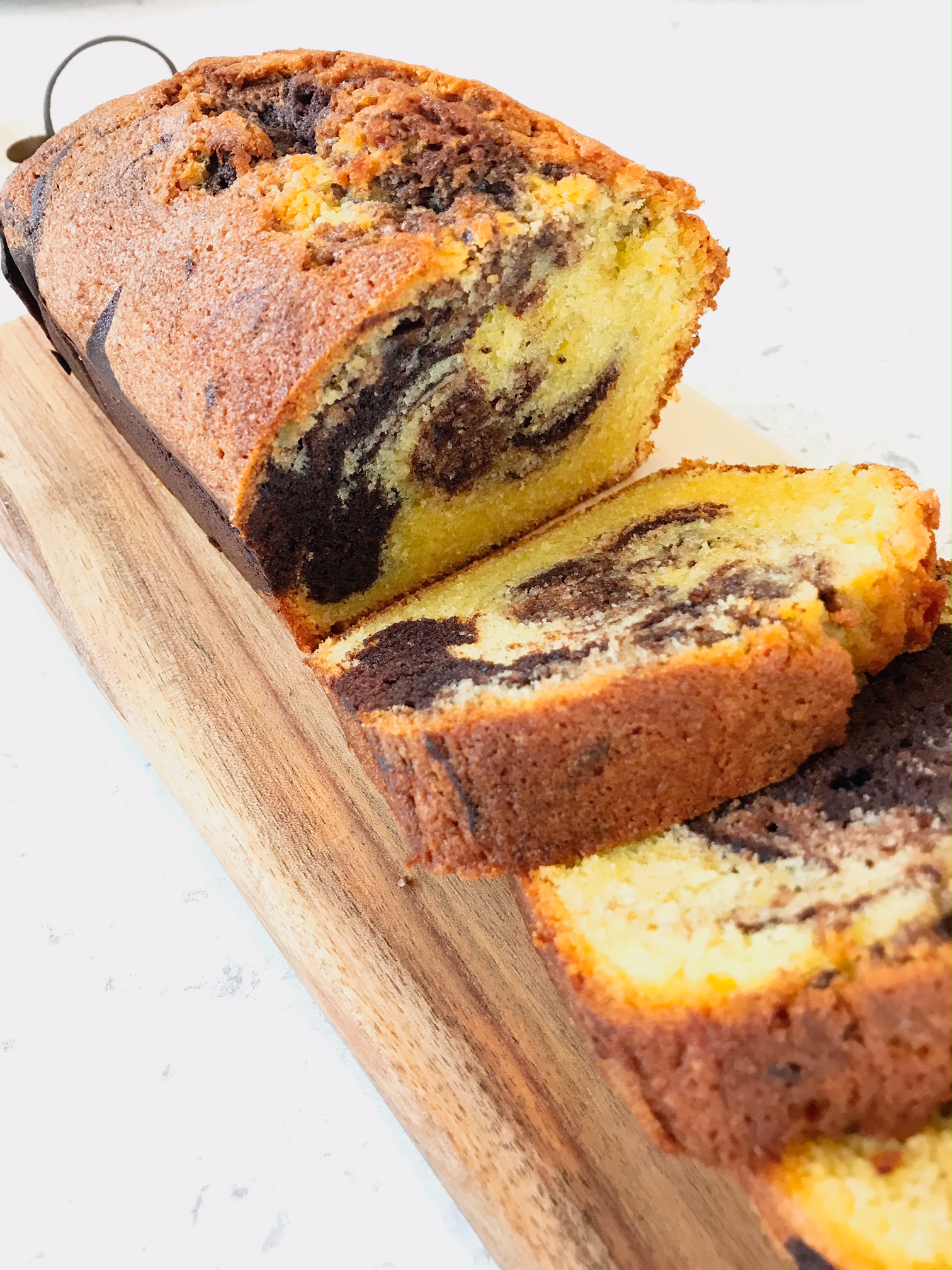Chocolate marble pound cake cut in slices.